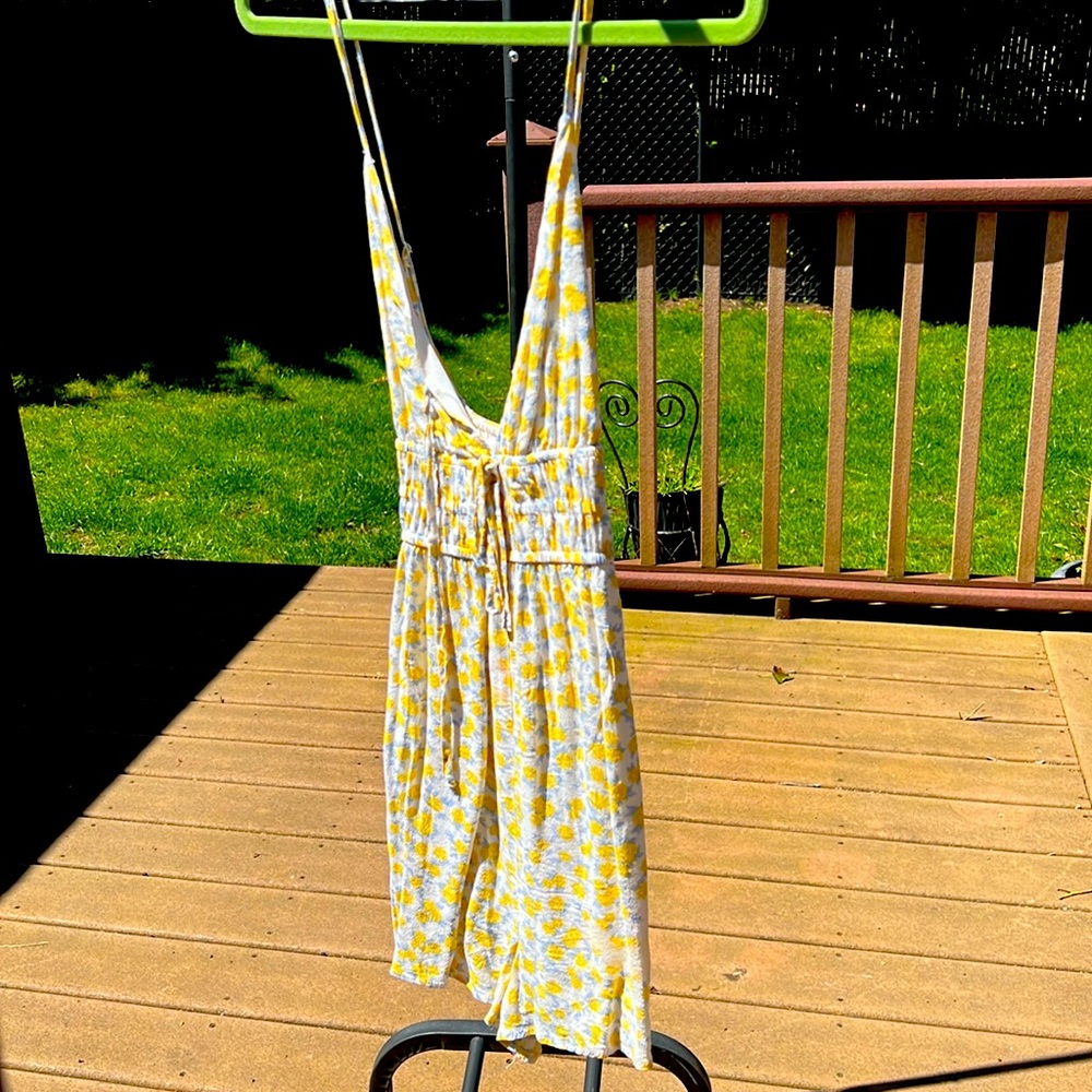 Yellow floral romper. Very cute summer dress size Small.